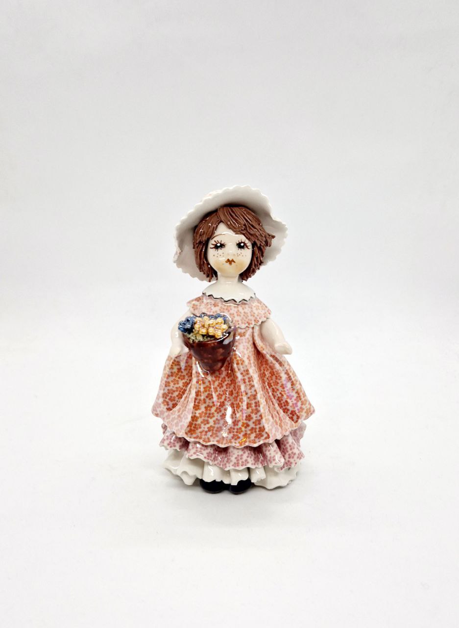 Doll with grapes