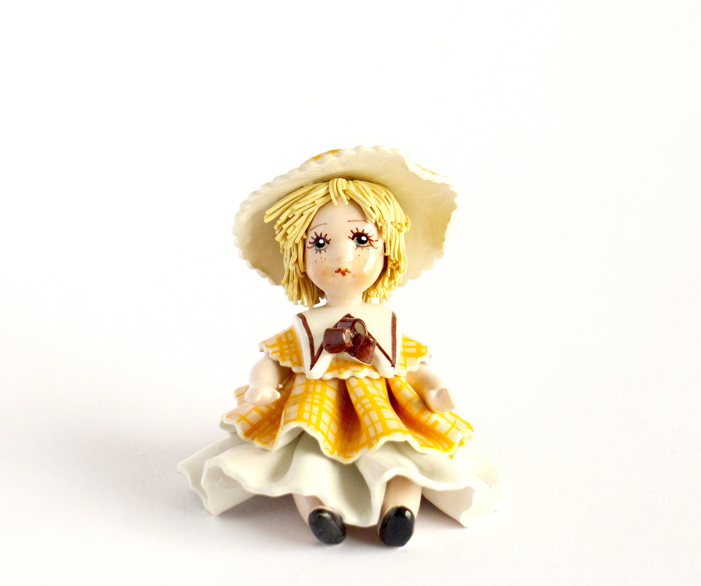 Sitting doll- yellow white dress
