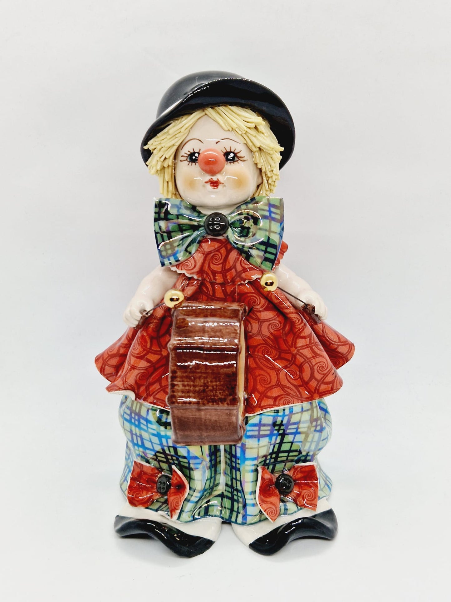 Clown musician on drum