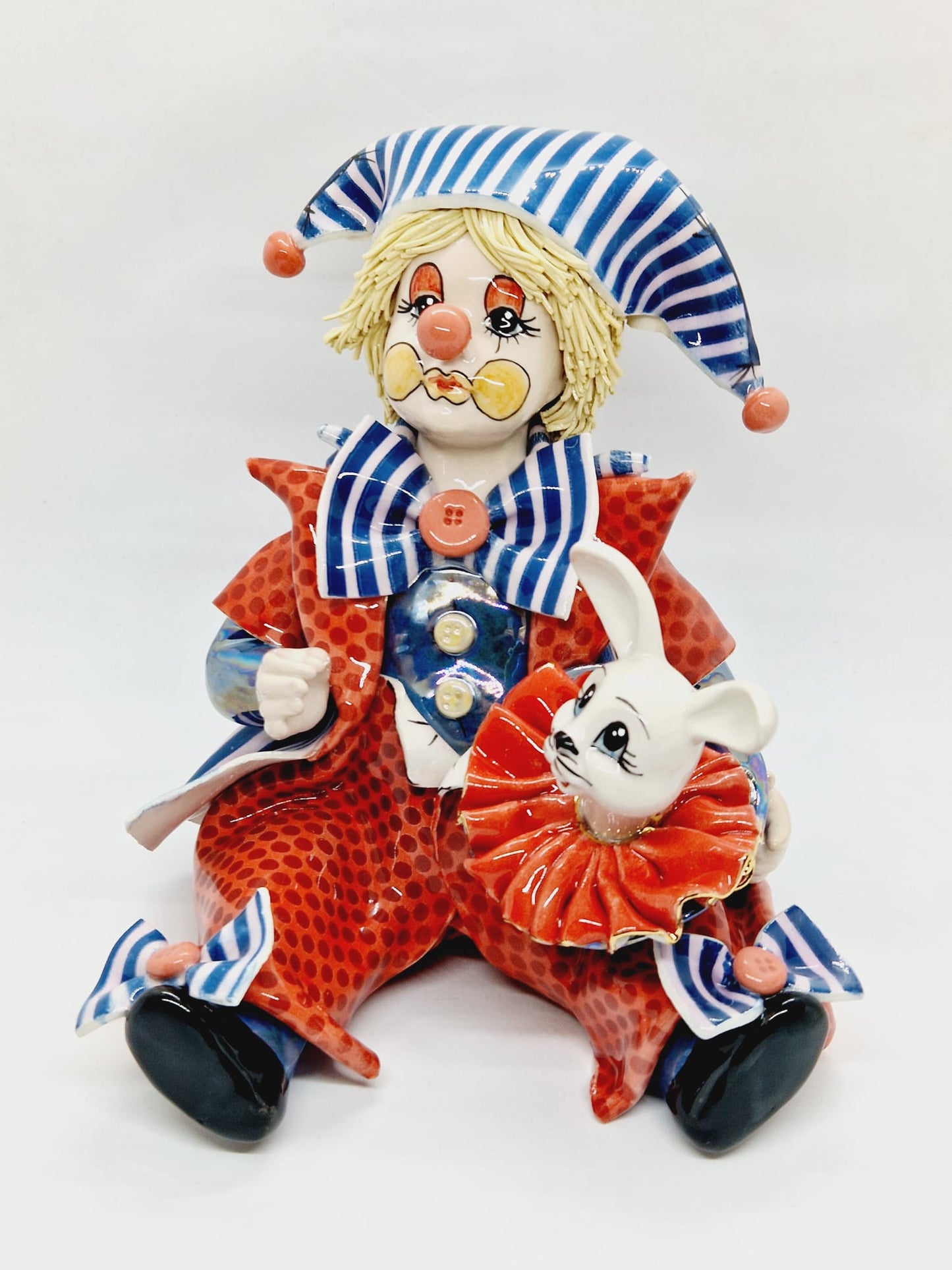 Clown holding rabbit