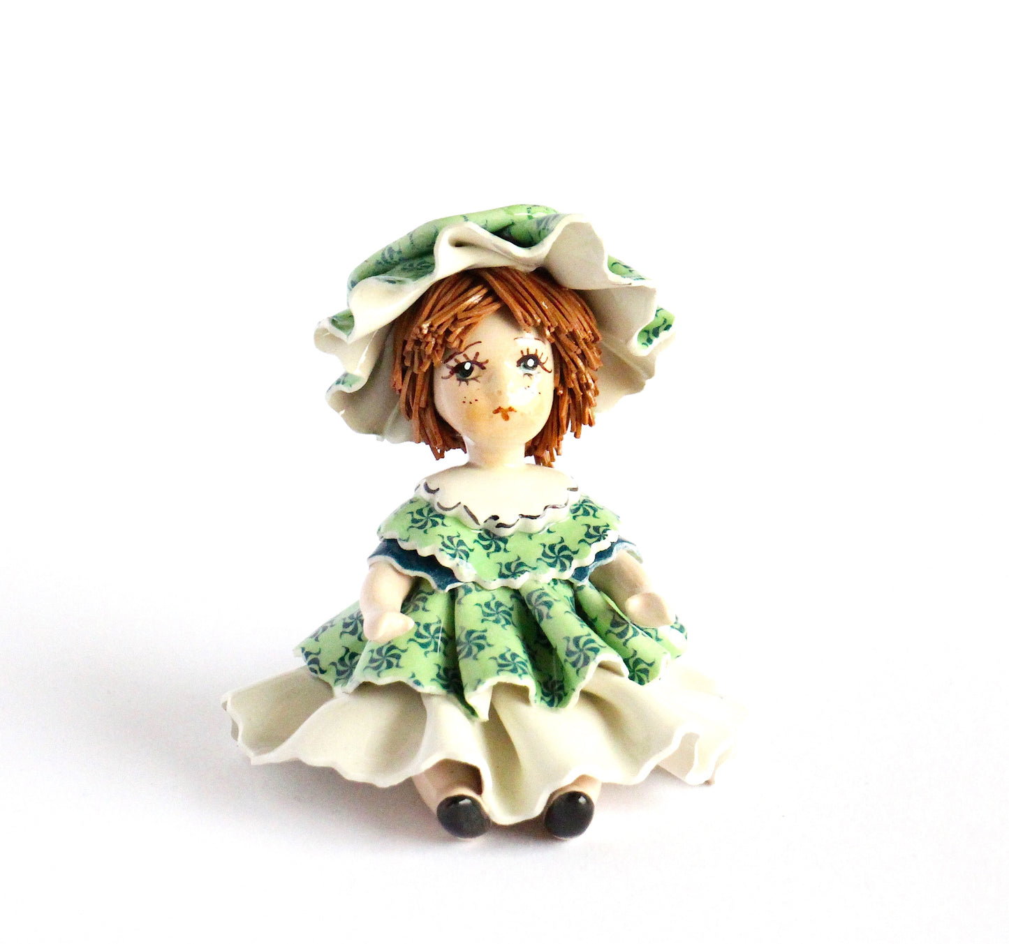 Sitting doll in green