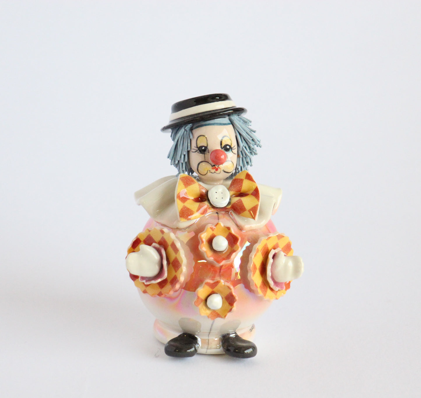 Standing clown with orange bow tie