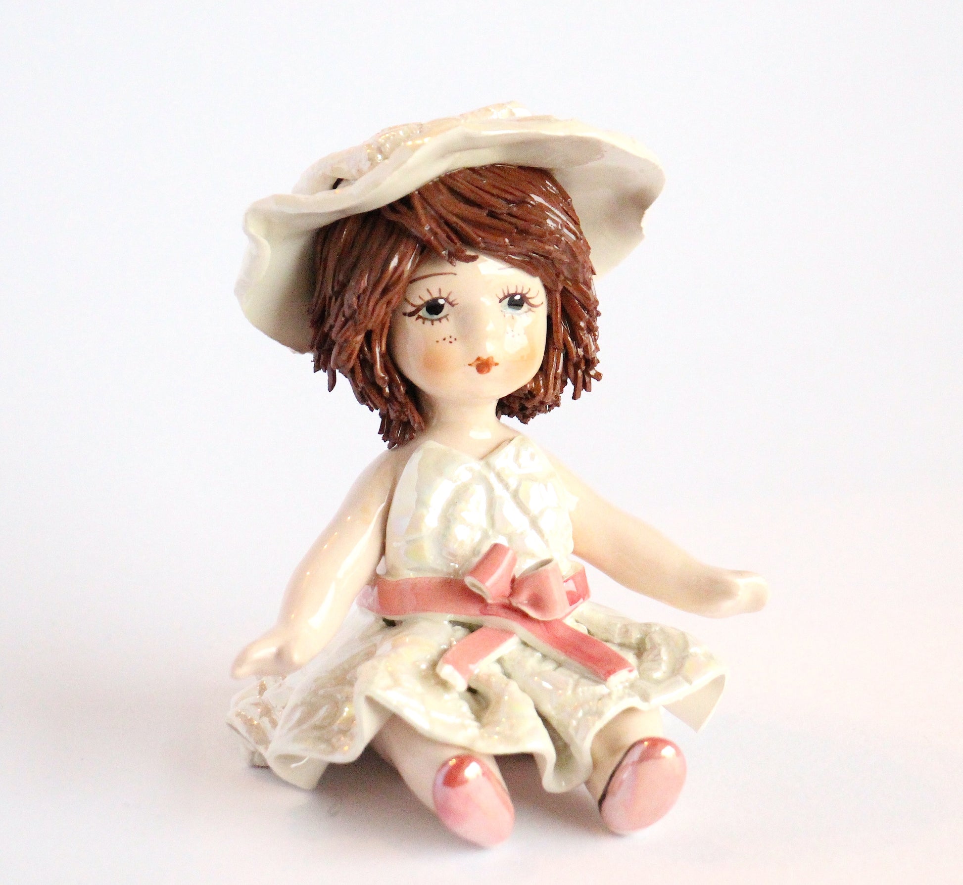 Sitting doll with belt