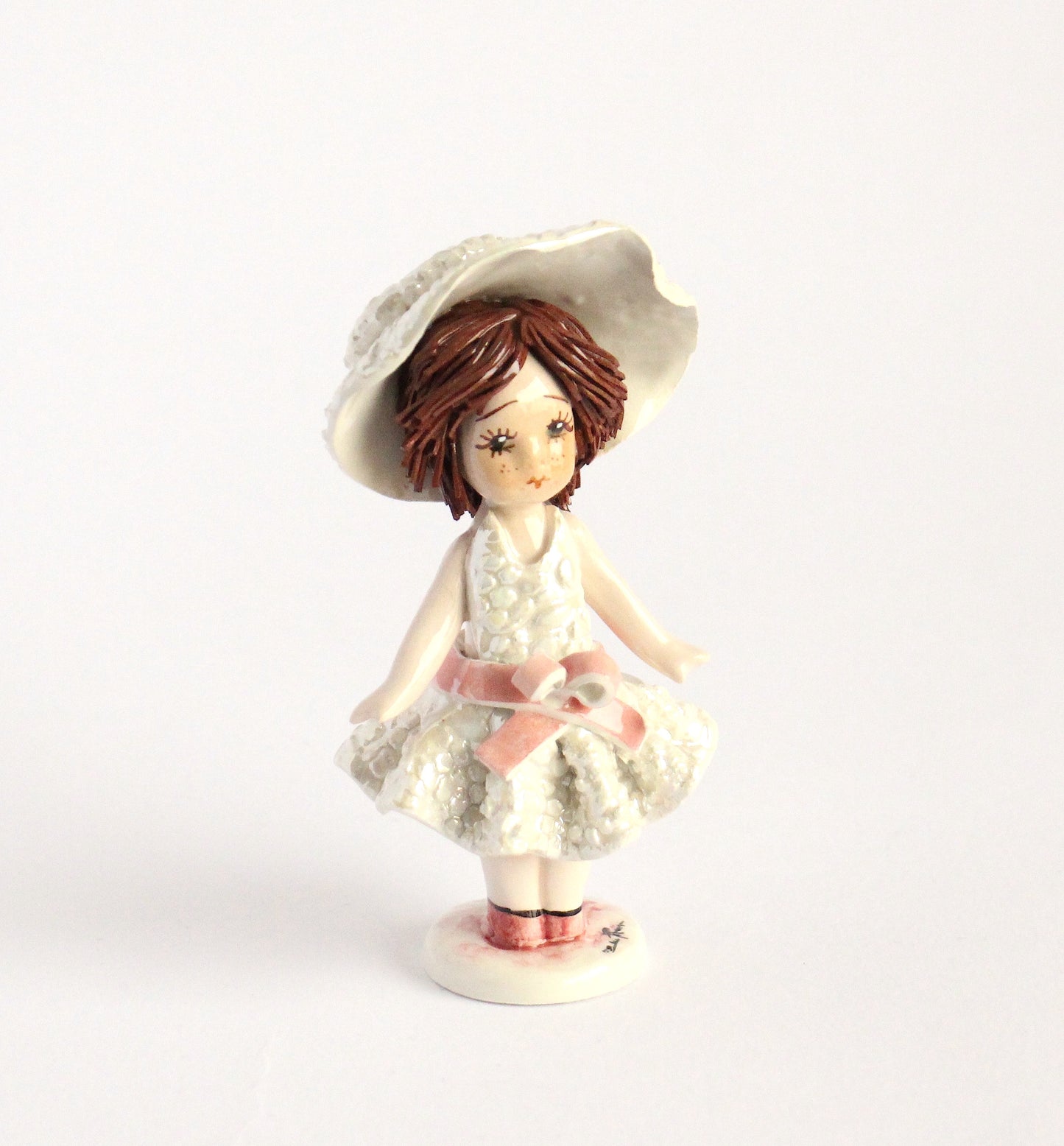 Standing doll- pink bow