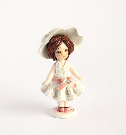 Standing doll- pink bow