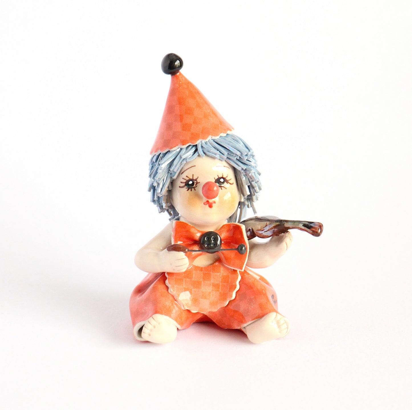 Sitting clown musician