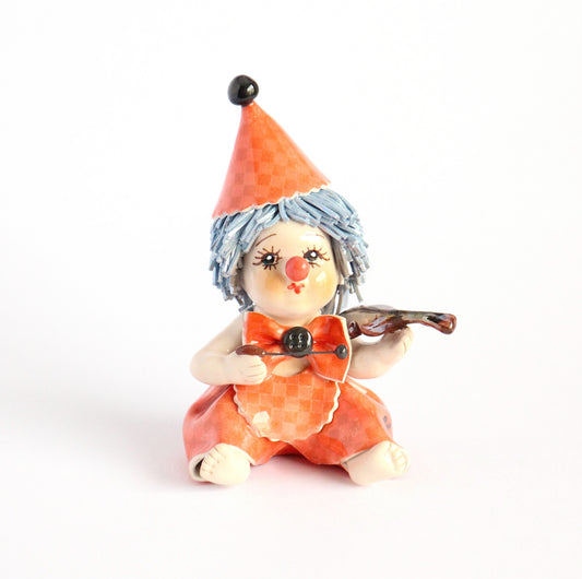 Sitting clown musician