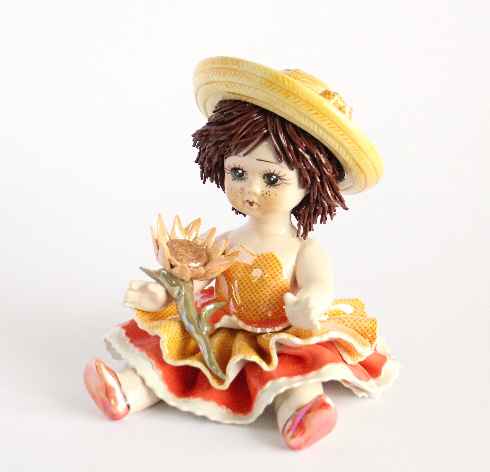 Sitting doll with sunflower