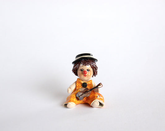 Sitting boy with violine