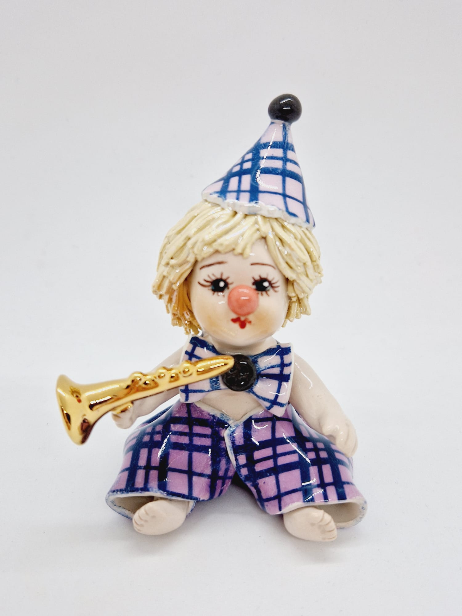 Sitting purple clown