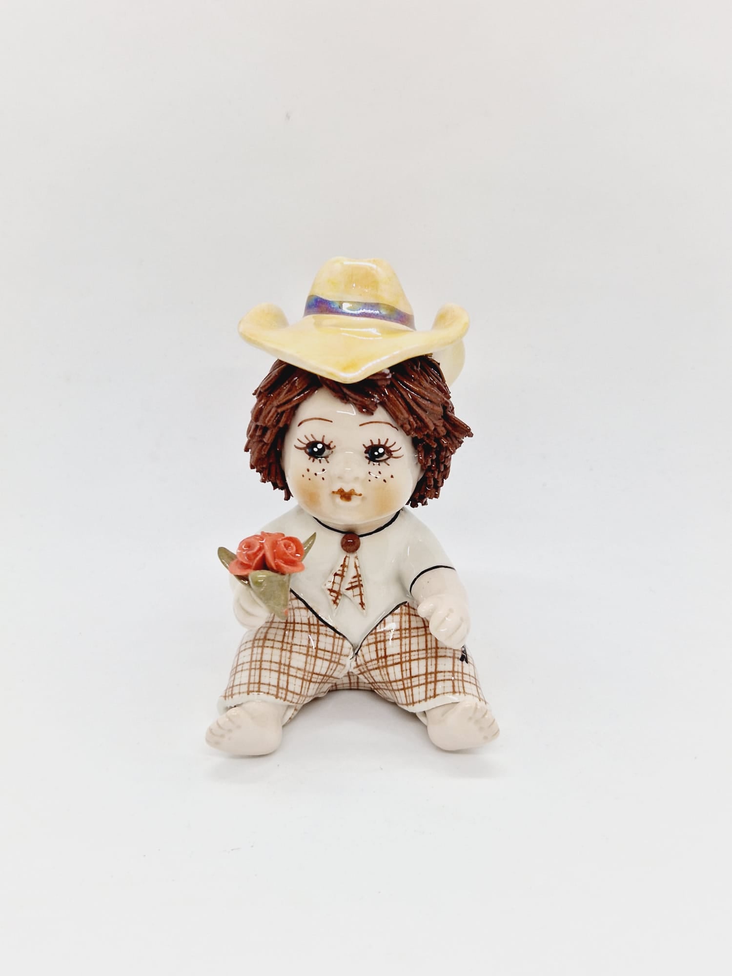 Young boy with a flower