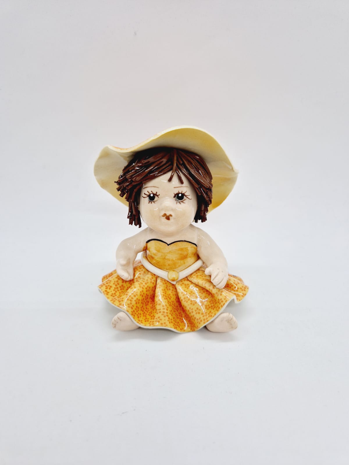 Baby with yellow dress