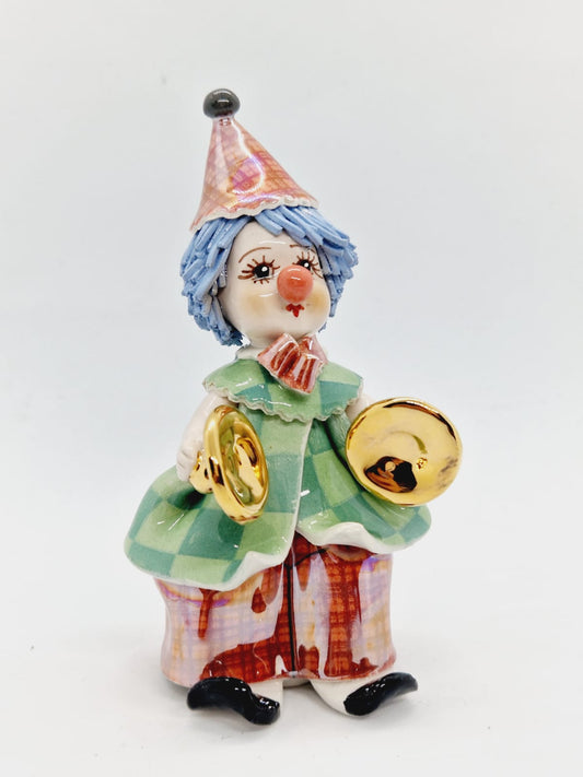 Clown with percussion instruments