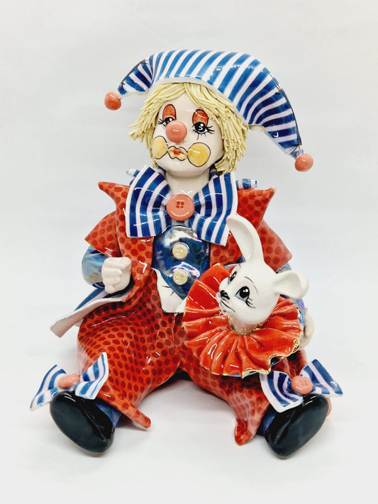 Clown holding rabbit