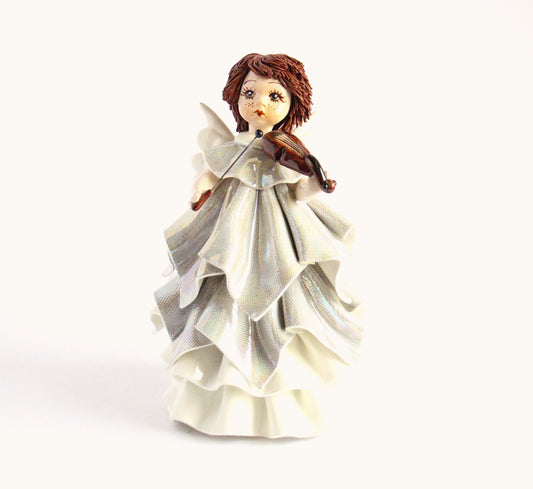 Standing angel playing violin