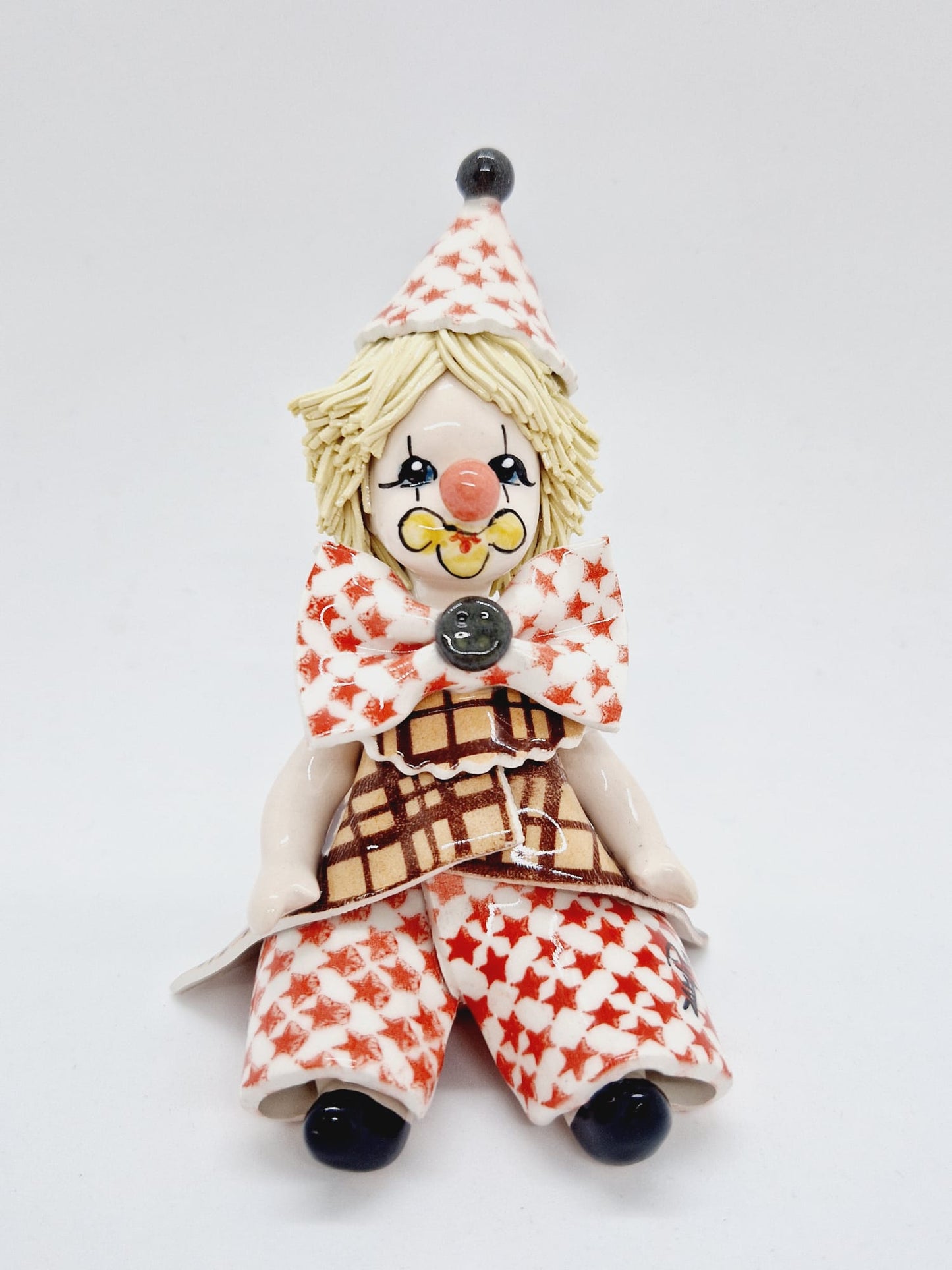 Sitting clown with stars