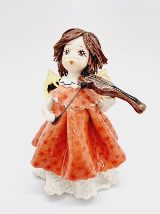 Doll playing violin